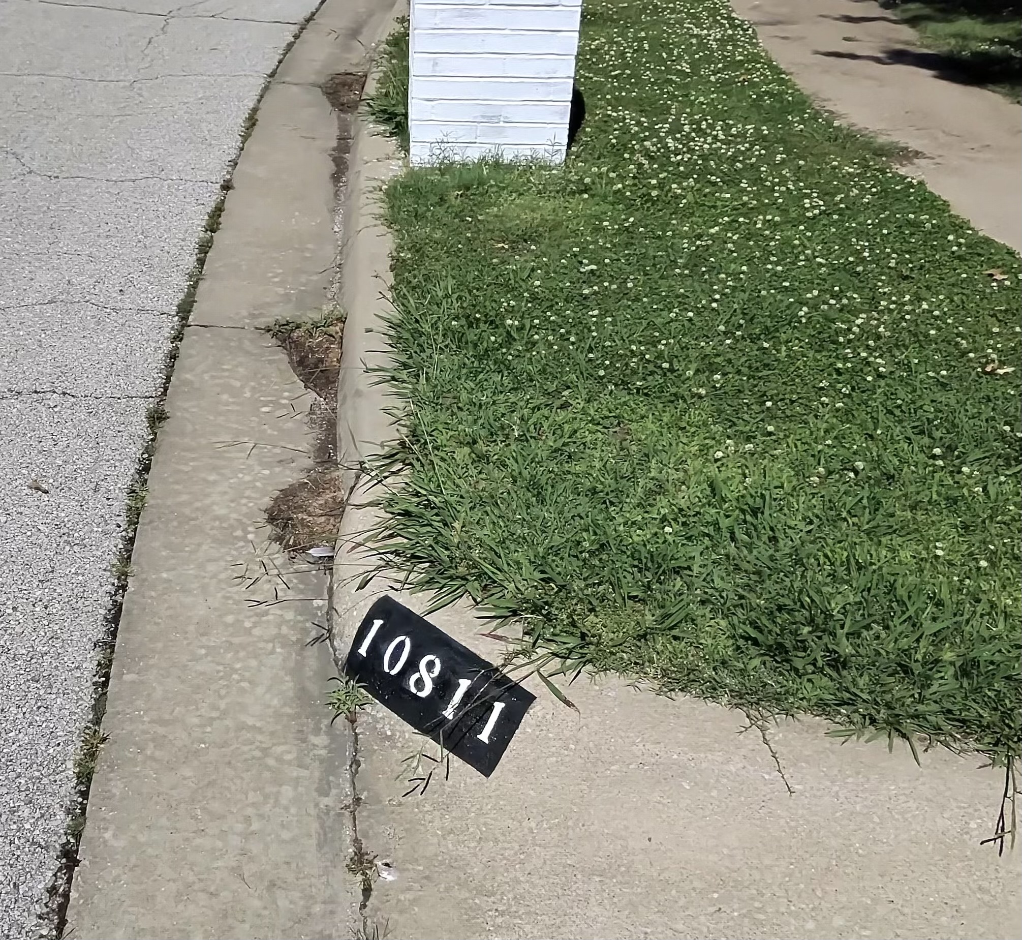 Painted curb number 10811 in Collinsville